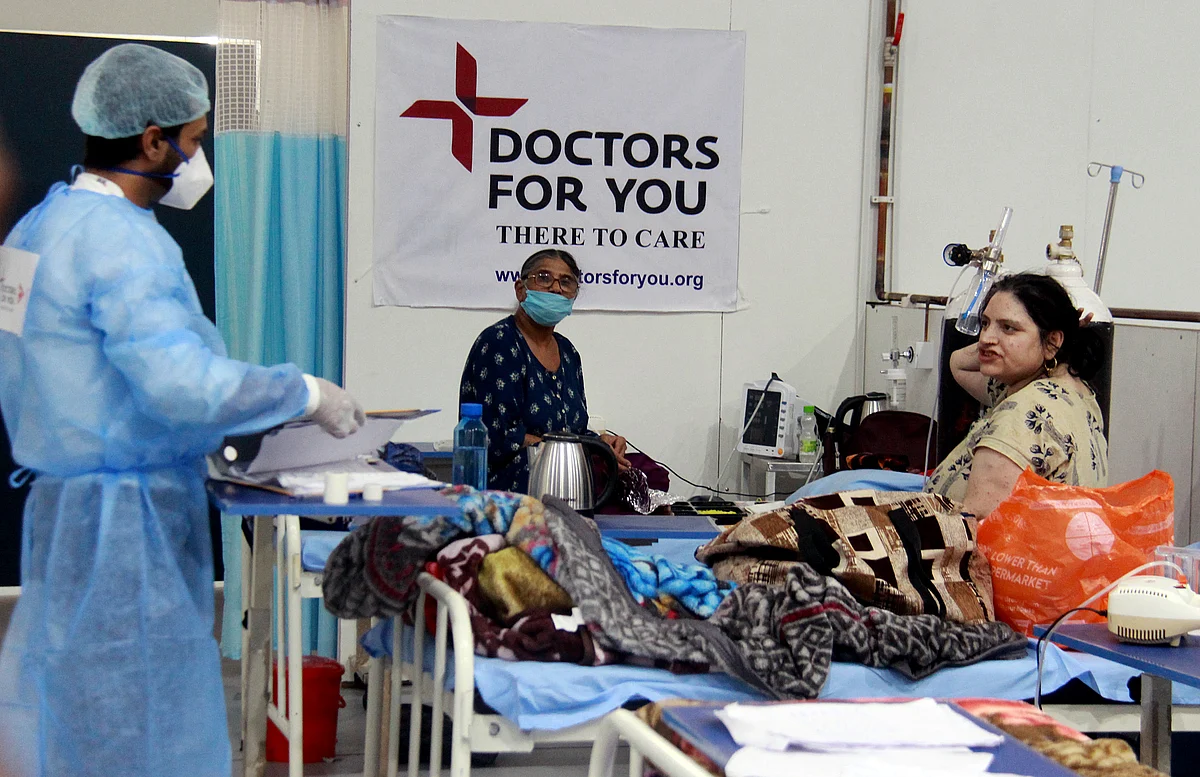 A healthcare worker interacts with patients in a Covid ward. Rural demand is expected to remain strong as forecast of a normal monsoon bodes well for sustaining its buoyancy going forward.
