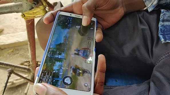 A group of children indulge in online gaming sitting on broken down rickshaw. Prime Minister Modi had unveiled a vision: IT + IT = IT, which means India’s talent plus information technology equals India tomorrow.