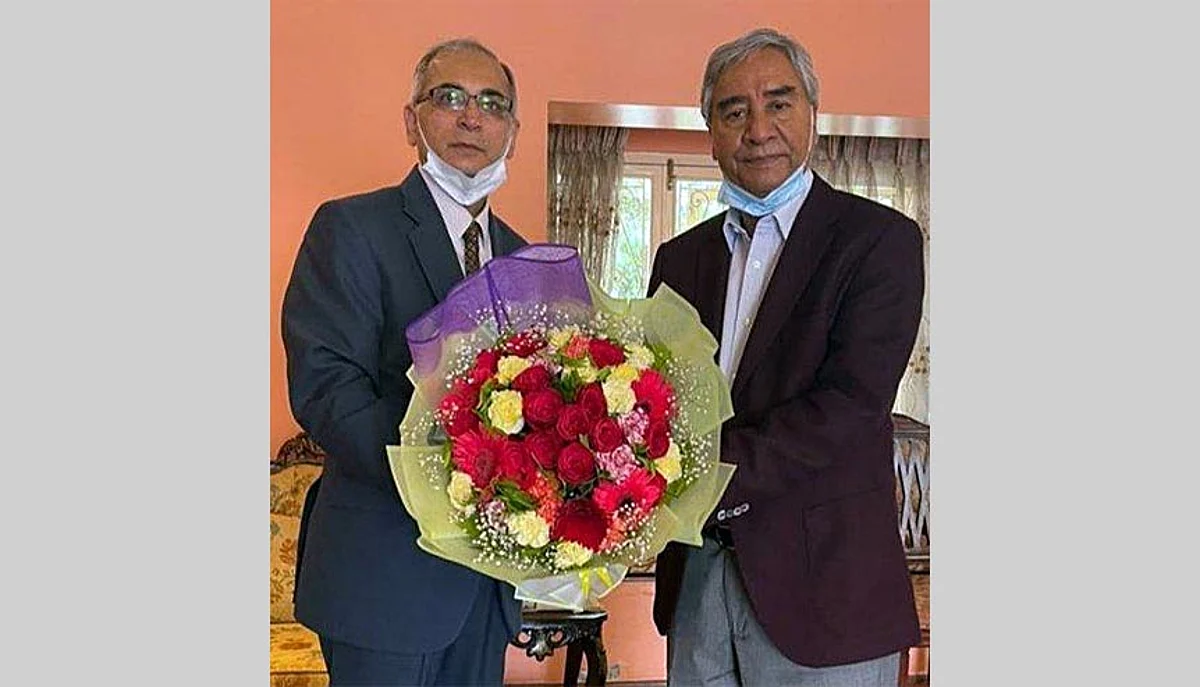 Indian envoy to Nepal Vinay Mohan Kwatra congratulates newly appointed Nepal Prime Minister Sher Bahadur Deuba at his residence, in Kathmandu. The new Nepali PM assumed office after a series of political twists and turns which led to the exit of former PM KP Sharma Oli.