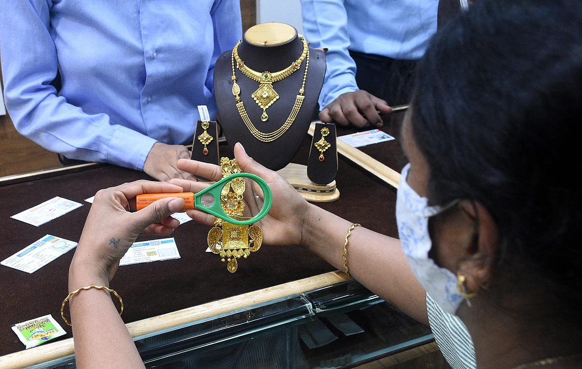 A jeweller shows trademarks to a customer. As of now trademarks are compulsory on gold jewellery .Gems and jewellery recorded 130.44 percent growth in India’s export checklist.