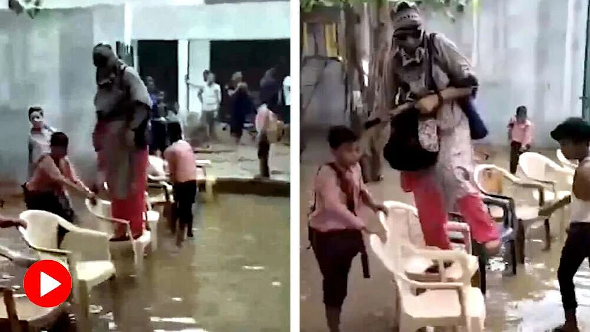 பள்ளிக்குள் நுழைந்த வெள்ளம்; ஆசிரியை நனையாமல் இருக்க சேர்களை அடுக்கிய மாணவர்கள்: அரசு எடுத்த அதிரடி