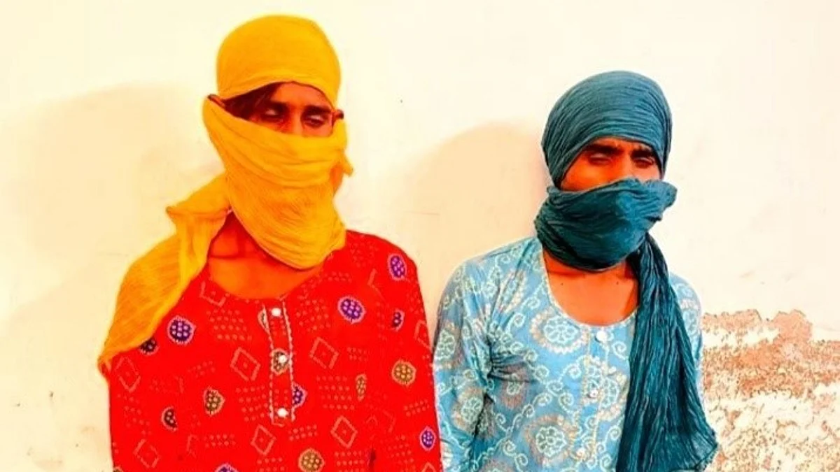 பெண் வேடமணிந்த கொள்ளையர்கள் மோனு, நிகில்.