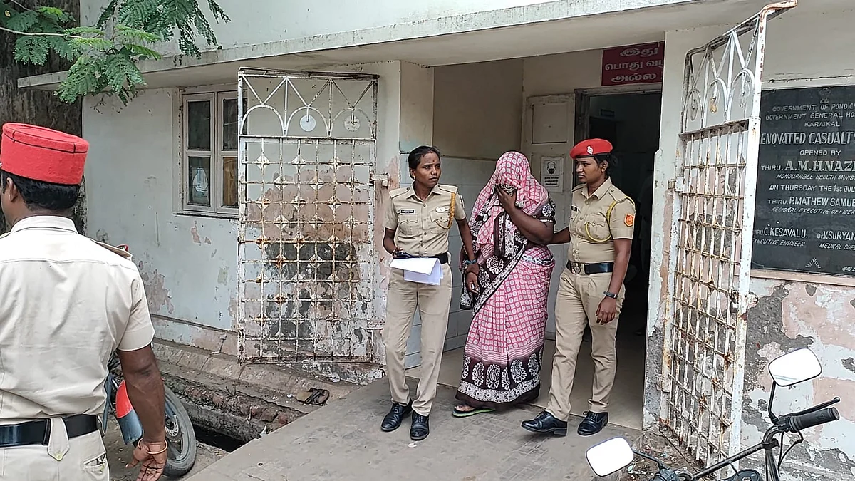 சகாயராணி விக்டோரியாவை அழைத்து வரும் போலீஸார்