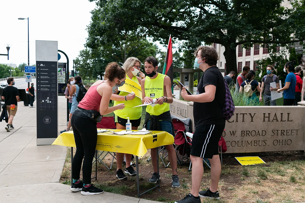 Members of the Committee to Recall Ginther collect signatures for a petition to do just that: recall Mayor Andrew Ginther. As of July 3, the petition had several thousands of the needed 15,000 signatures.