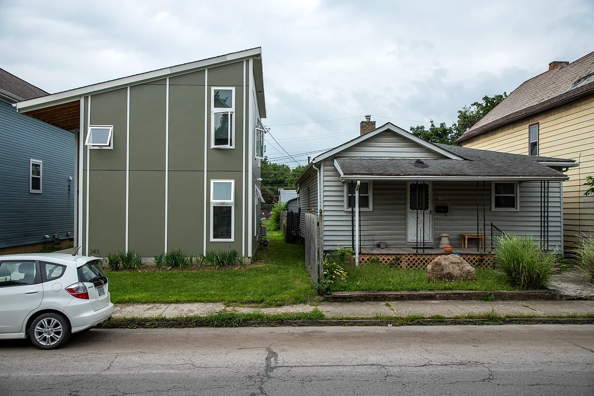 Jeremy Miller, architect and 6-year resident, lives in a custom build in Franklinton. The house next door is owned by Debbie Hawkins, who has lived in her home for two decades.