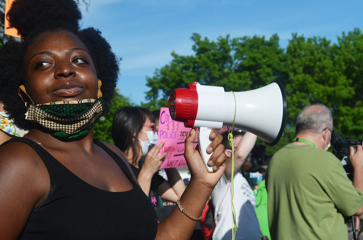 Kanyinsola Oye, an alumnae of Columbus City Schools, protests at the home of CCS Board President Jennifer Adair on June 8.