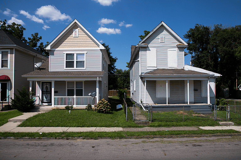 The home on the left was built in 2013 and is valued at $107,900. To the right sits a seemingly vacant home built in 1900, valued at $17,000.