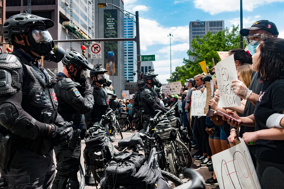 Protesters and Columbus police officers in riot gear confront one another at the intersection of Broad and High Street on May 30, 2020. The riot gear uniforms officers wear during civil unrest do not accommodate body cameras because the gear was purchased prior to the Division’s implementation of the cameras in 2016.