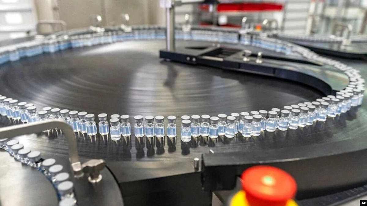 This August 2022 photo provided by Pfizer shows vials of the company's updated COVID-19 vaccine during production in Kalamazoo, Mich (Image Source- VOA)