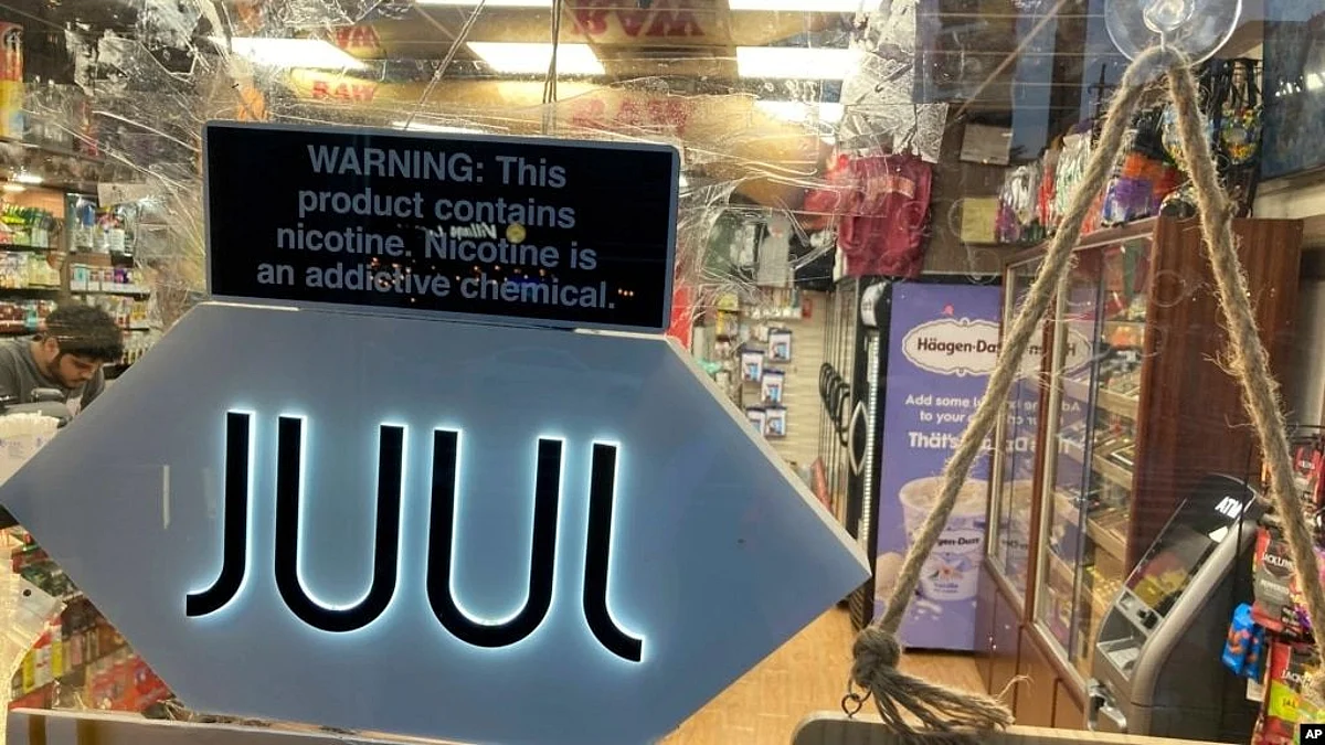 A Juul electronic cigarette sign hangs in the front window of a bodega convenience store in New York City on June 25, 2022 (Image Source- VOA)
