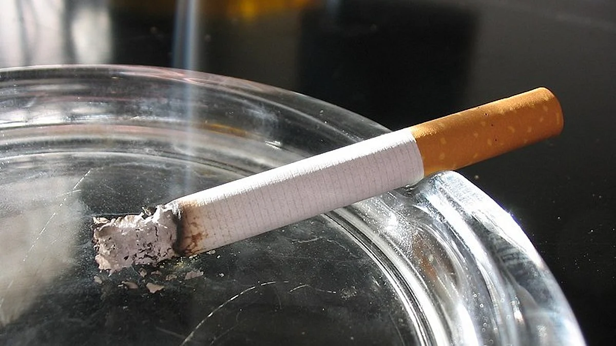 A lit cigarette in an ashtray. Wikimedia Commons
