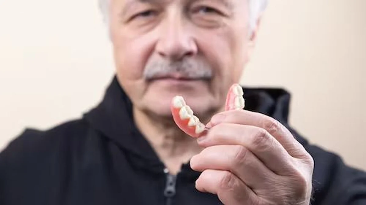 Dentures are classified into full and partial dentures and removable and fixed dentures. Your dentist will advise you based on your treatment type (Unsplash)