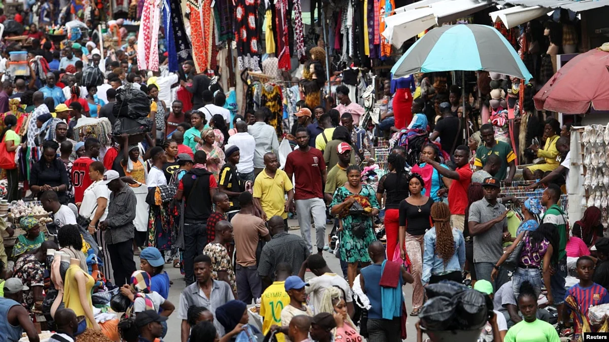 FILE - Shoppers crowd a market in Nigeria's commercial capital of Lagos, Aug. 15, 2019. Eight countries worldwide, including Nigeria, are expected to account for more than half of the global population growth over the next three decades.