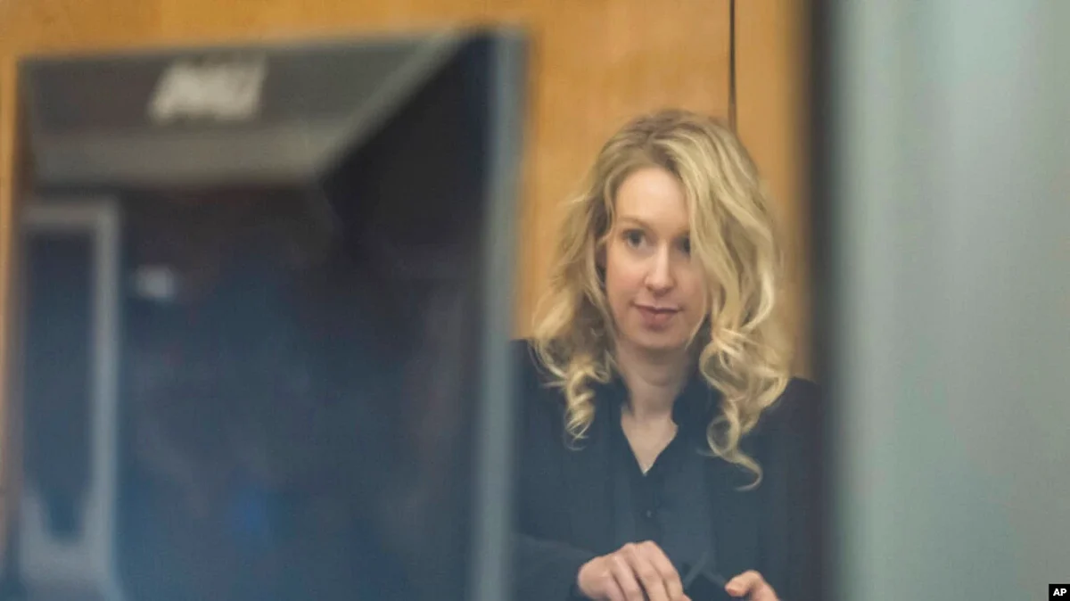 Theranos founder and CEO Elizabeth Holmes arrives at federal court in San Jose, Calif., Nov. 18, 2022. A federal judge sentenced her to prison for duping investors and endangering patients while peddling a bogus blood-testing technology.