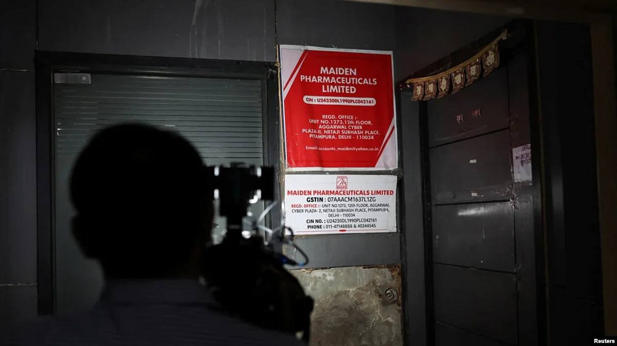 FILE - A cameraman takes visuals outside the office of Maiden Pharmaceuticals Ltd. company, in New Delhi, India, Oct. 6, 2022.