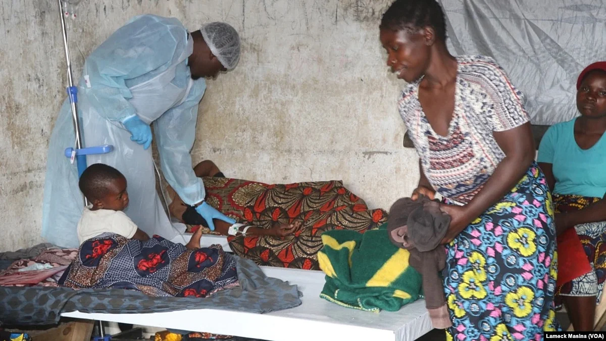 Medical staff takes care of a cholera patient inside a cholera ward in Blantyre, Malawi