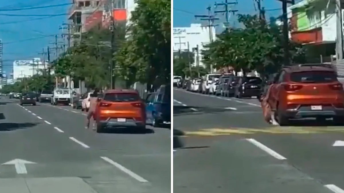 Captan a hombre desnudo aferrado a puerta de coche, en Veracruz