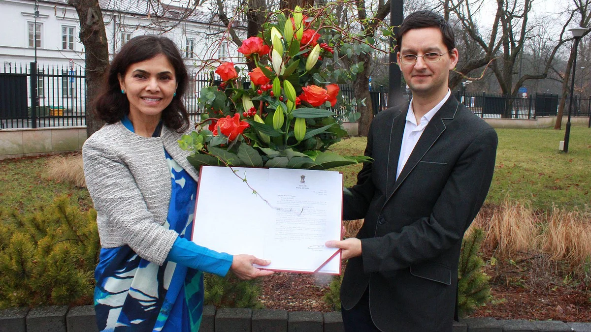 Indian Envoy to Poland, Nagma M. Mallick handing over PM Modi's letter to Polish scholar Krzysztof Iwanek on Jan. 26, 2022.
