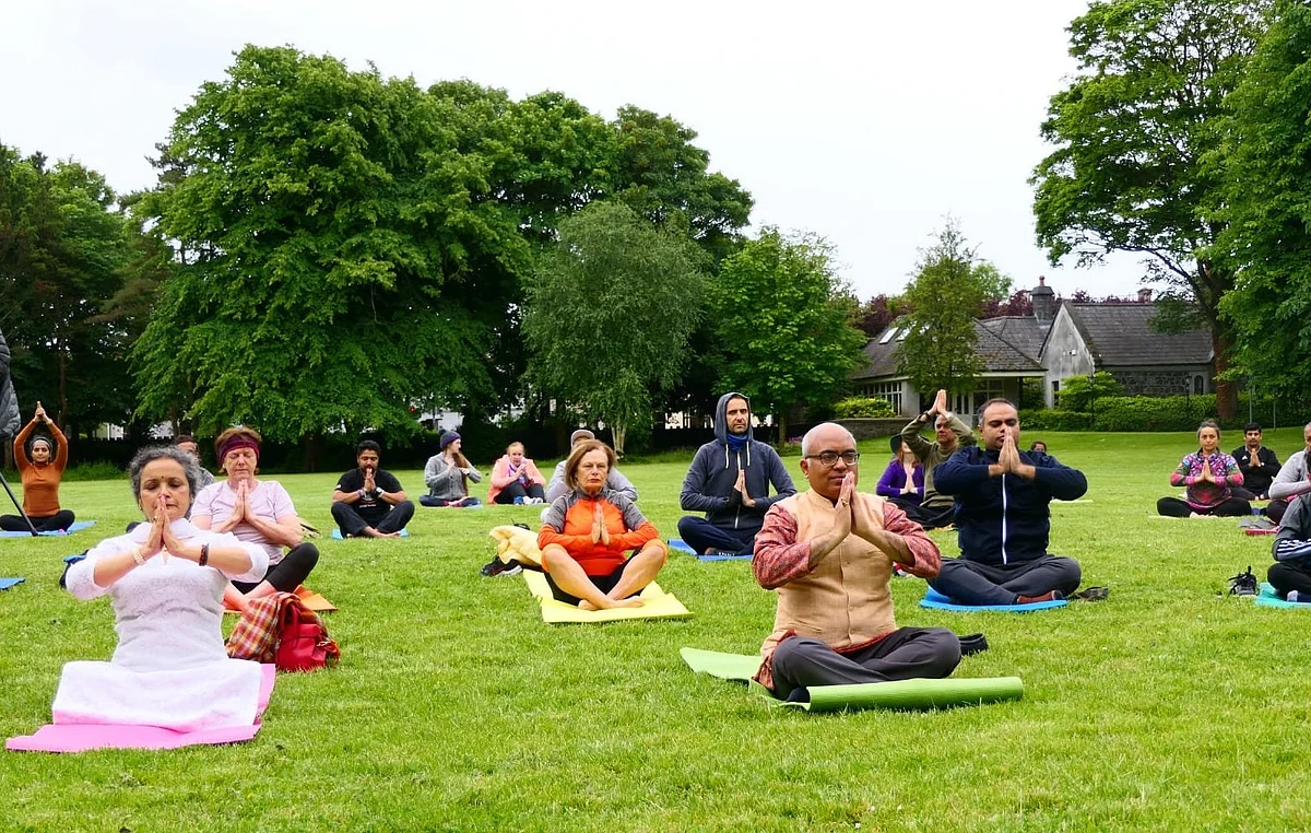 FILE PHOTO: The Indian Ambassador Akhilesh Mishra and his wife Reeti Mishra perform Yoga during the 8th Yoga Day celebrations at the National University of Ireland, Dublin.