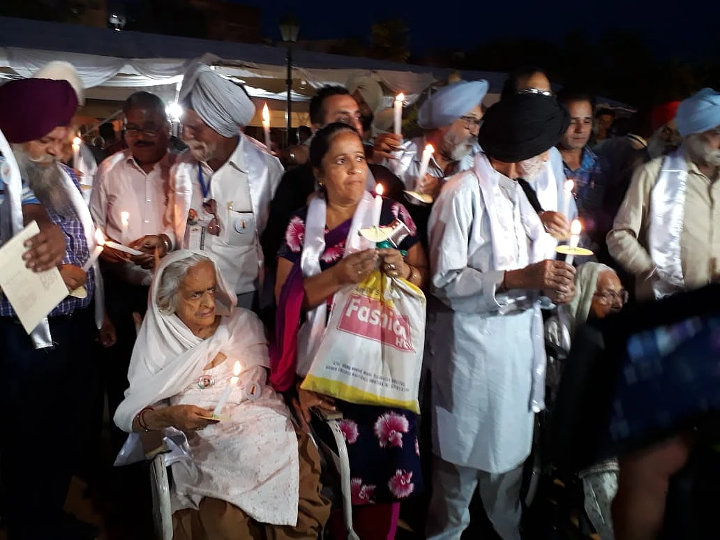 Senior citizens, freedom fighters and family members of the martyrs of Jallianwala Bagh massacre taking part in the candle march (Photo by Pramod Pushkarna)