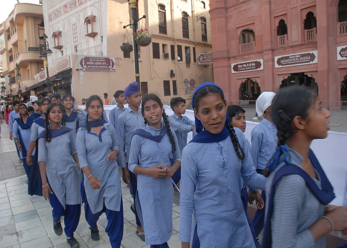 School children walking to take part in the candle march (Photo by Pramod Pushkarna)