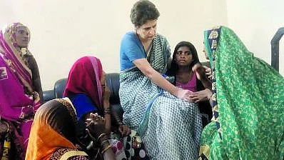 Priyanka Gandhi with the families of Sonbhadra carnage victims (file photo).