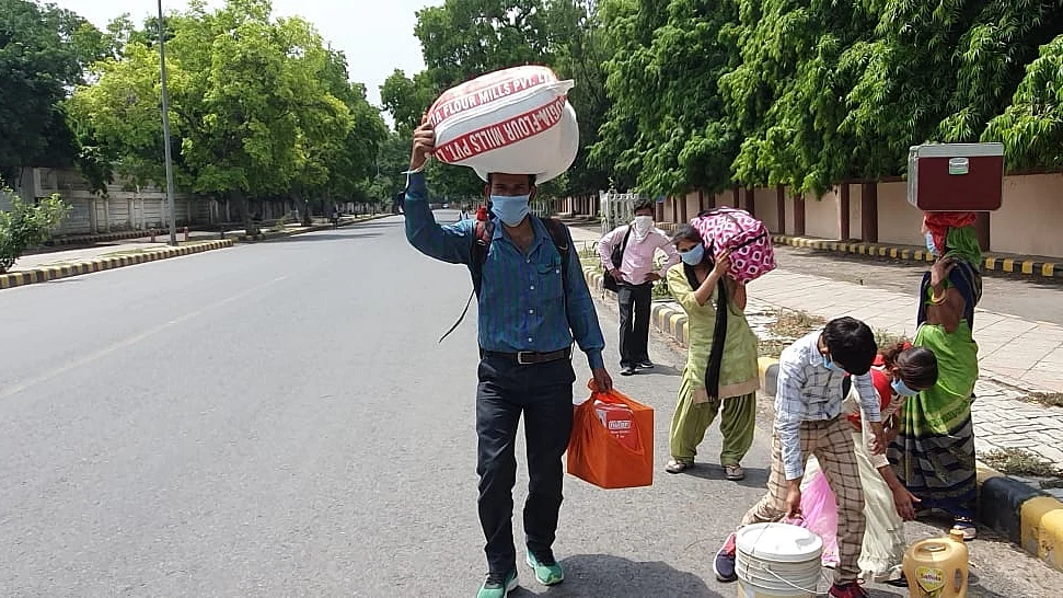 Migrants set off for 700km on foot as govt starts AC trains