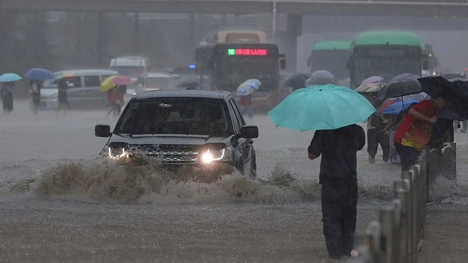 Flooding in central China turns streets to rivers, kills 12