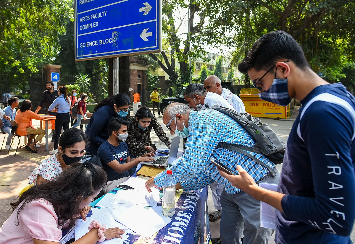 Candidates filling admission forms at DU