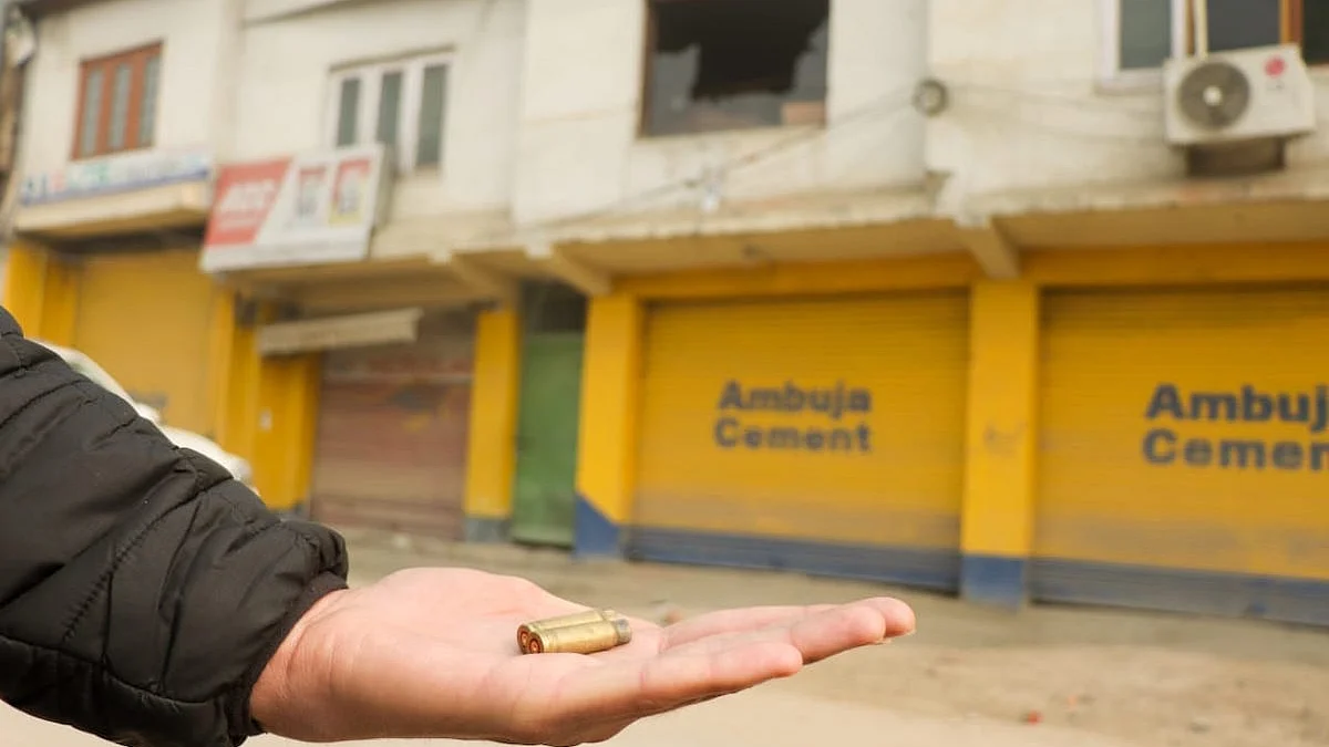 A local resident shows the bullet casing near the gun battle site (Credit: Mir Zeeshan)