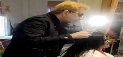 Hair-raising: Jawed Habib creates furore by spitting on woman's head