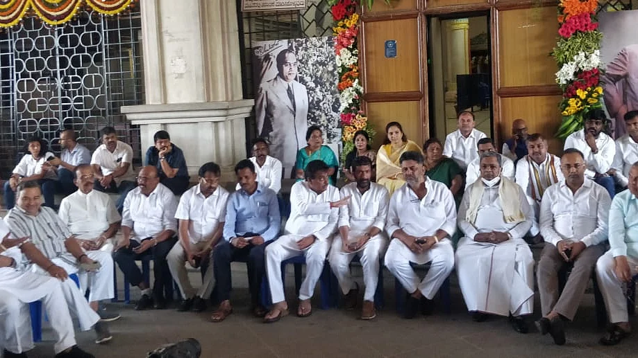Congress leaders led by D K Shivakumar and Siddaramaiah staging an overnight dharna outside the Vidhana Soudha in Bengaluru on Thursday demanding arrest of K S Eshwarappa