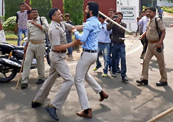 Police manhandles a student at Aligarh Muslim University during anti-CAA protests in Dec 2019