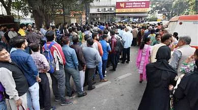 People stand outside bank to withdraw rationed money in the wake of demonetisation. More than 100 people reportedly died in the aftermath of note ban in Nov 2016