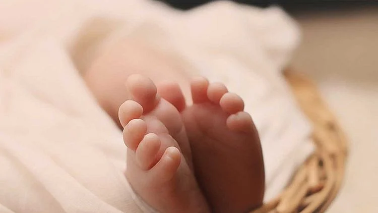 After mix-up at birth, woman reunited with son after DNA match