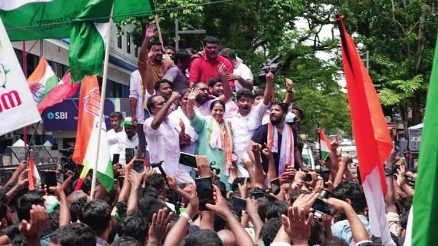 Uma Thomas with children & supporters