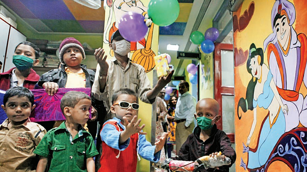 Child cancer patients play inside the paediatric oncology division of Tata Memorial Hospital in Mumbai