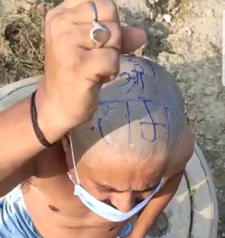 वाराणसी में नेपाली युवक का सिर मुंडवाकर लिखा ‘जय श्री राम’, नेपाल के पीएम ओली के बयान के विरोध में लगे नारे
