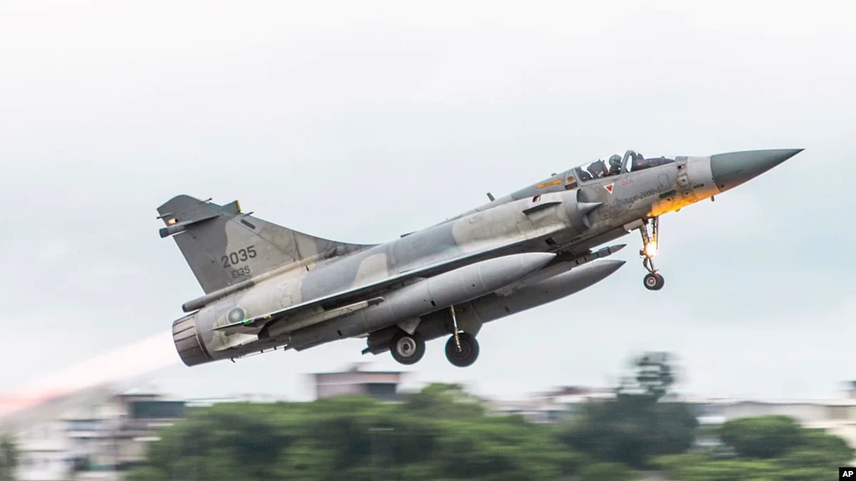 In this photo released May 27, 2022, by the Taiwan Ministry of National Defense, a French-made Mirage fighter jet takes off from an airbase near Pingtung in Southern Taiwan. On Tuesday, Taiwan scrambled jets to warn away Chinese aircraft in its air defence identification zone.