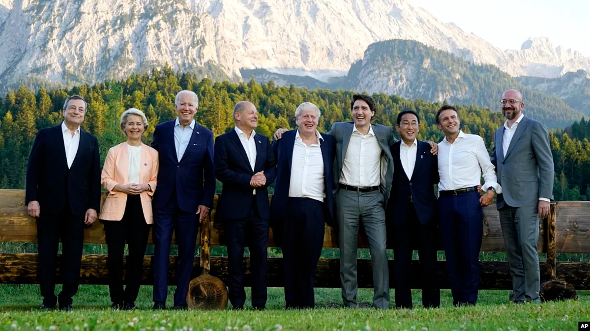 Members of the Group of Seven, including European Union leaders, pose for a photo at Schloss Elmau, following dinner, in Elmau, Germany, June 26, 2022.