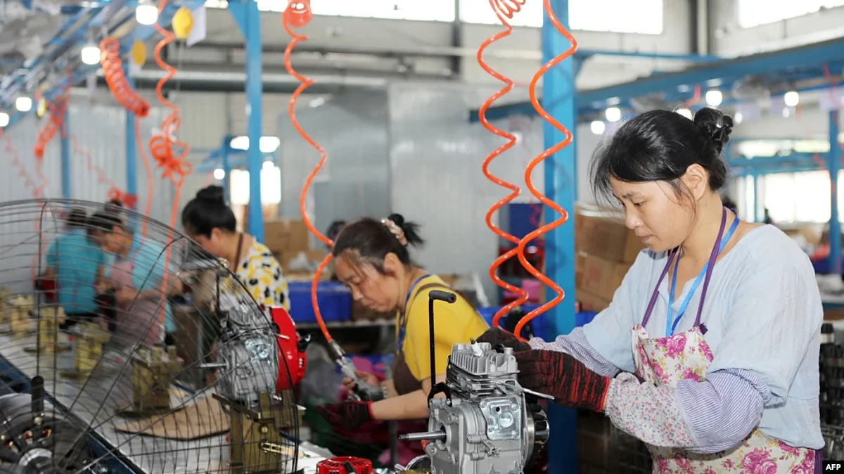 A worker produces miniature tillers at a factory in China's southwestern Chongqing, July 29, 2022.