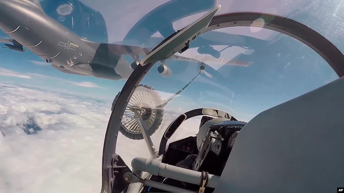 The air force & naval aviation corps of the Eastern Theater Command of the Chinese PLA conducts aerial refuelling at an unspecified location, on Aug 4, 2022.