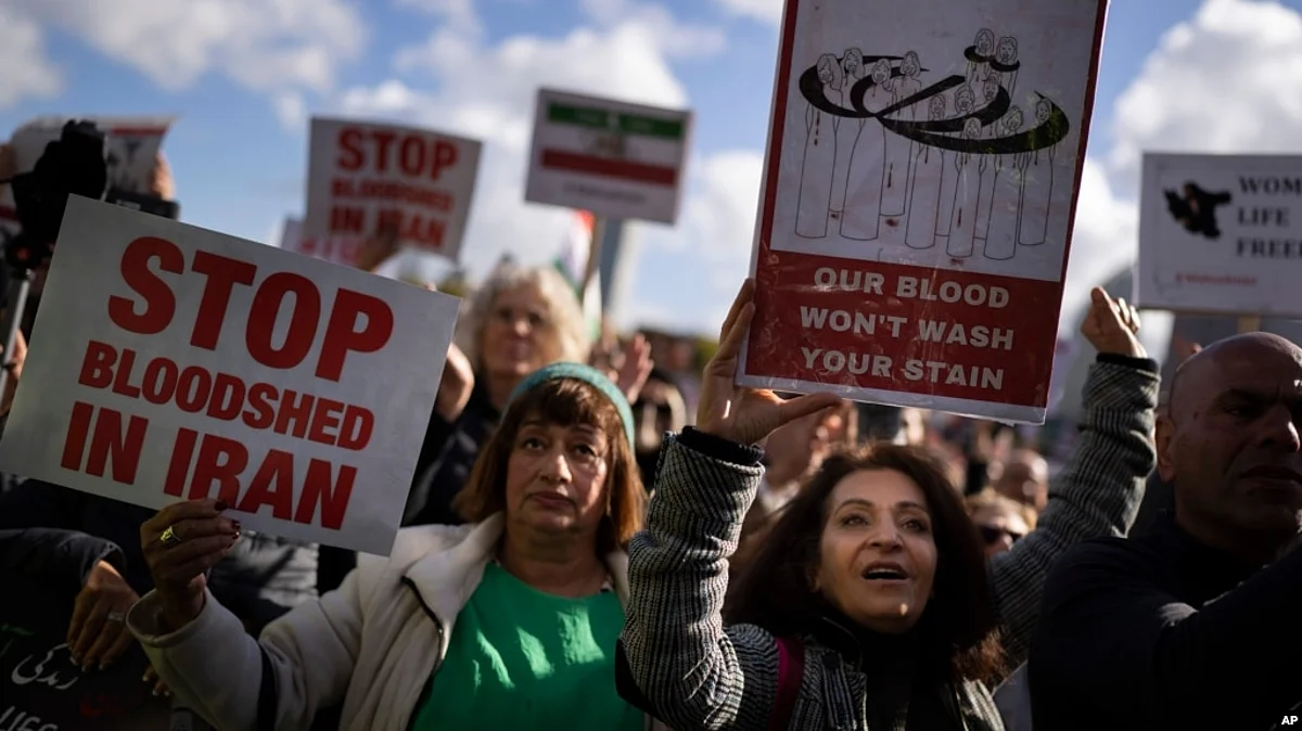Thousands showed their support for Iranian protesters standing up to their leadership over the death of a young woman in police custody, in The Hague, Netherlands, Oct. 8, 2022.