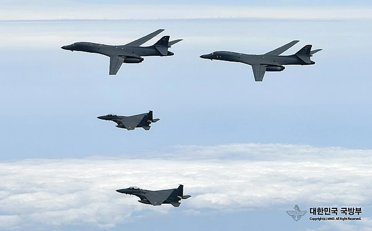 U.S. Air Force B-1B Lancers assigned to the 9th Expeditionary Bomb Squadron, deployed from Dyess Air Force Base, Texas, fly with South Korean F-15 fighter jets over the Korean Peninsula. (File Photo)