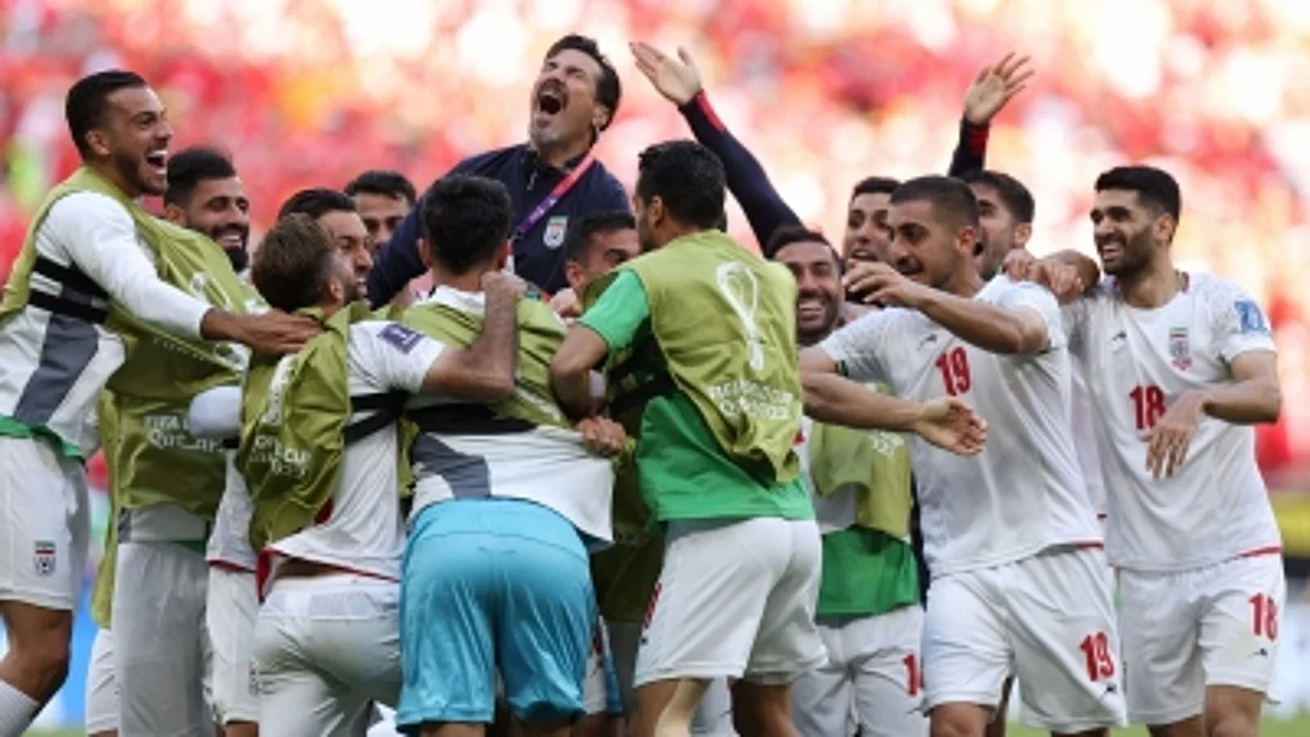 Late goals by Roozbeh Cheshmi and Ramin Rezaeian gave Iran a crucial 2-0 win over 10-man Wales in the Group B match of the FIFA World Cup at the Ahmed Bin Ali Stadium here on Friday.