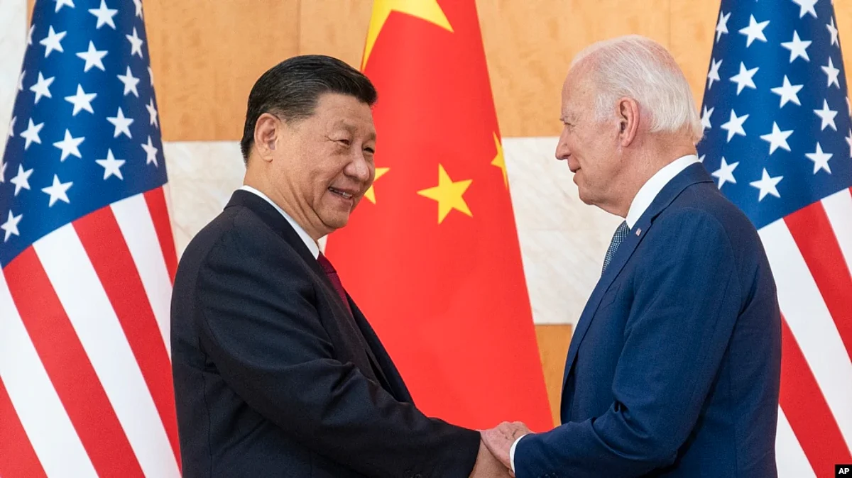 FILE - U.S. President Joe Biden, right, and Chinese President Xi Jinping shake hands before a meeting on the sidelines of the G-20 summit meeting on Nov. 14, 2022, in Bali, Indonesia.