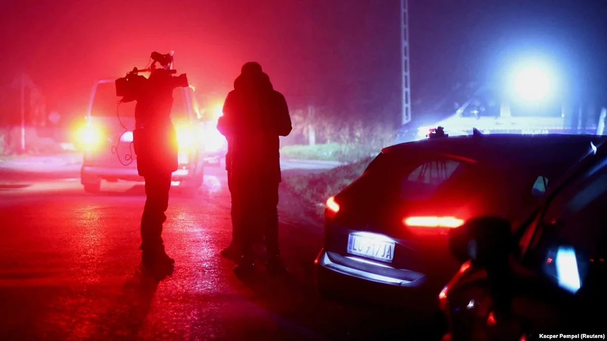 Poland: Members of the media stand near a police blockade after explosions rocked the Polish village of Przewodow near the border with Ukraine on November 15.