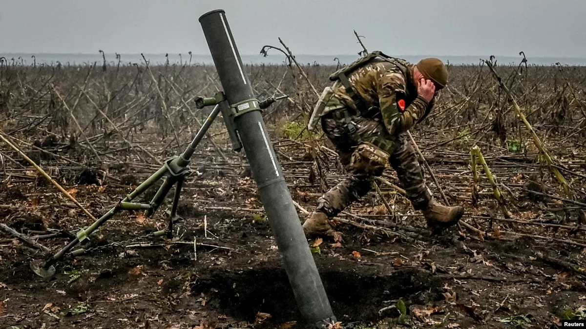 A Ukrainian soldier fires a mortar on the front line in the Zaporizhzhya region on November 16.