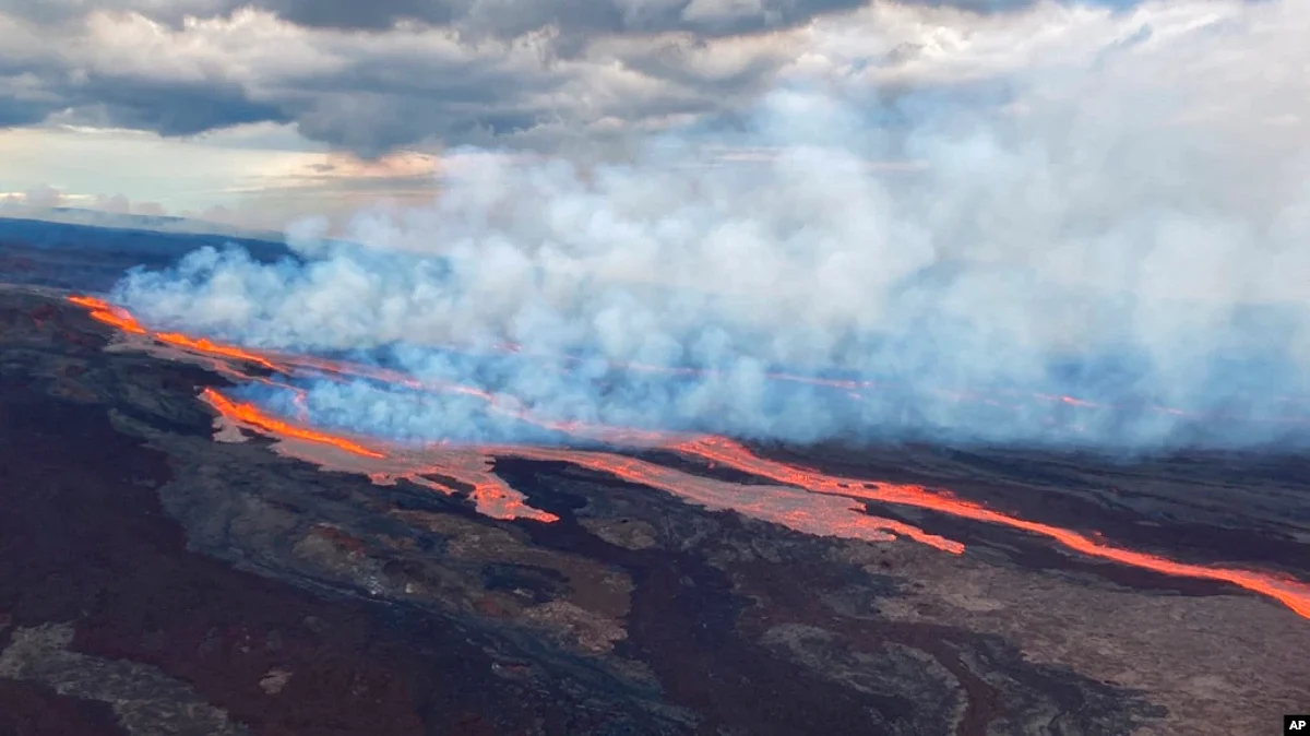 In this aerial photo released by the U.S. Geological Survey, the Mauna Loa volcano is seen erupting from vents on the Northeast Rift Zone on the Big Island of Hawaii, Nov. 28, 2022-AP