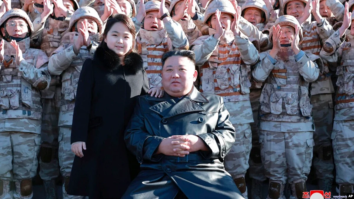 This undated photo provided on Nov. 27, 2022, by the North Korean government shows North Korean leader Kim Jong Un and his daughter with soldiers at an unidentified location in North Korea.